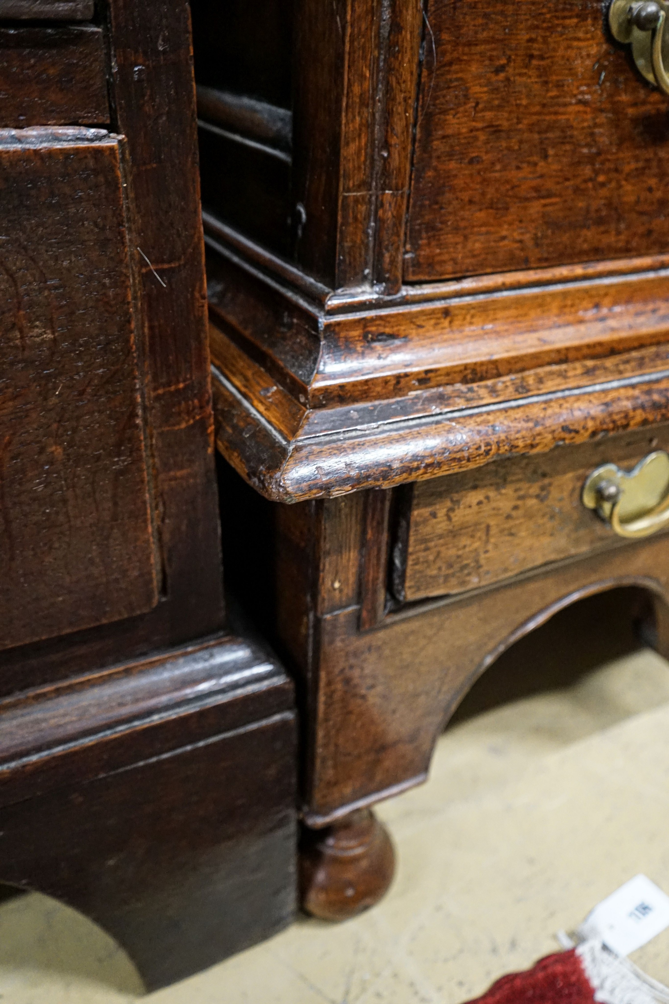 An early 18th century oak chest on stand, fitted two short and four long drawers, width 106cm, depth 56cm, height 117cm